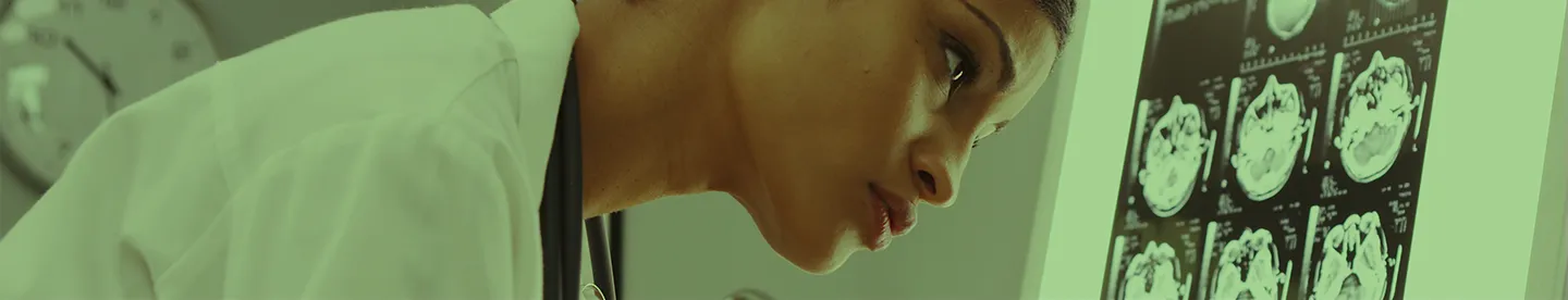 doctor looking at brain scans in lab