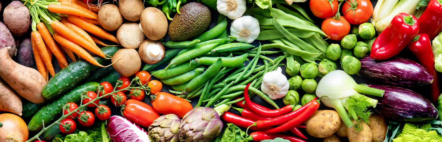 Food background with assortment of fresh organic vegetables