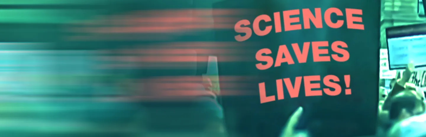 A protest sign that says "Science Saves Lives!"