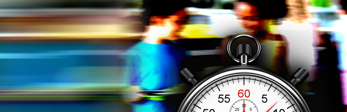 Children holding school lunch trays with a stopwatch in front of them