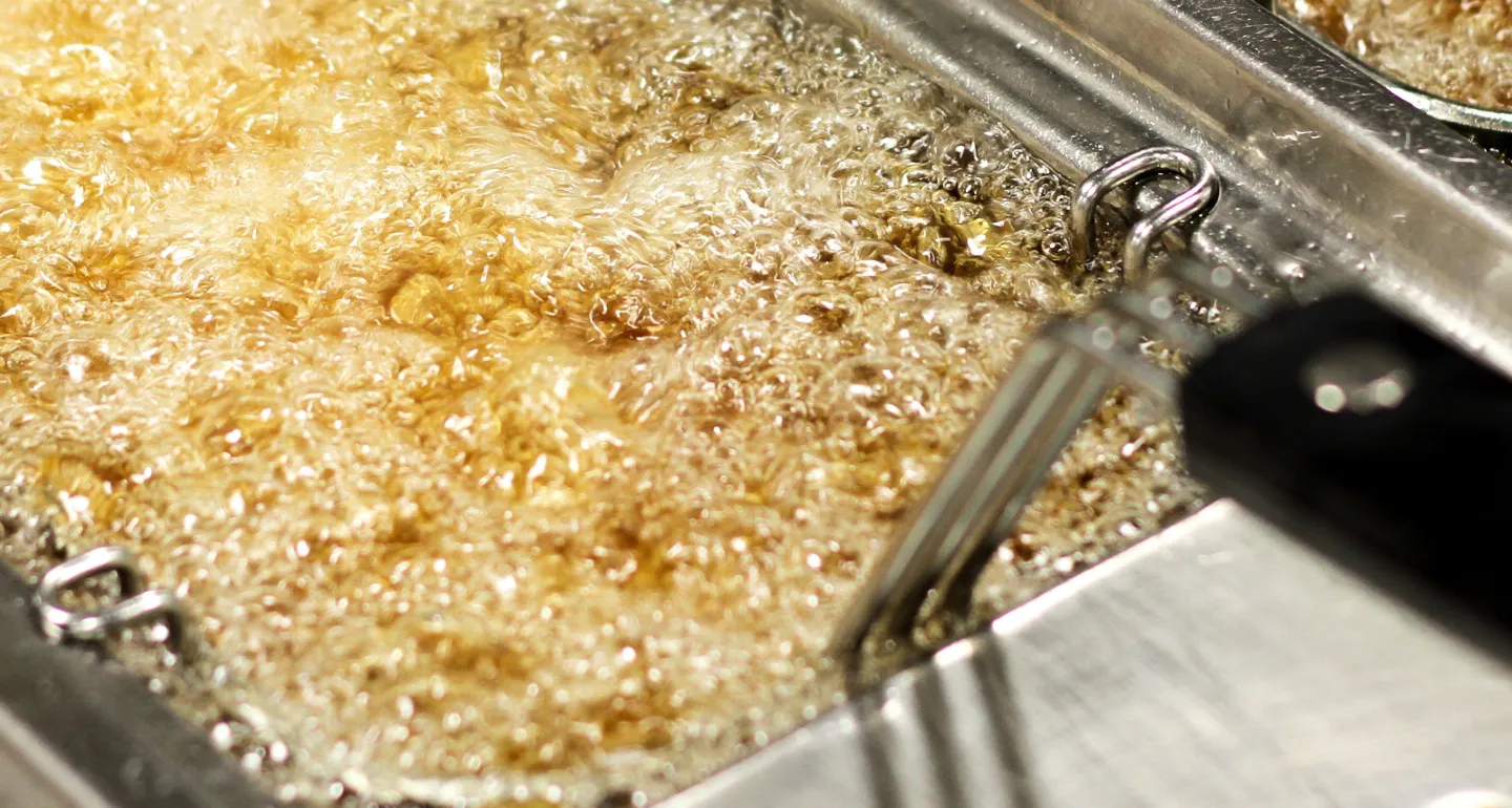 beef tallow boiling in a commercial fryer 