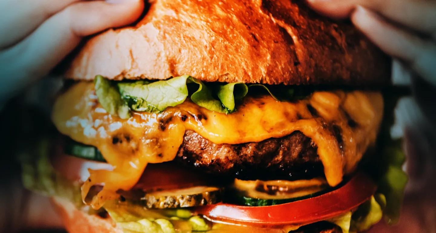 Closeup of a juicy unhealthy cheeseburger