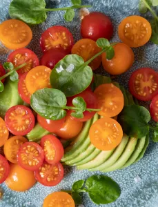 tomatoes and sliced avocado on plate