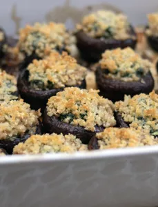metal pan filled with stuffed mushrooms