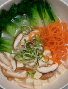 bowl filled with vegies sitting in miso broth