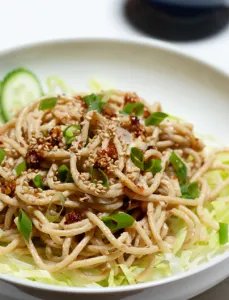white bowl filled with sesame noodles