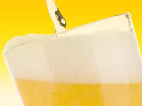 beer pouring into a glass