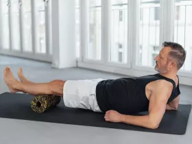 man using an exercise roller