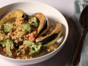 grains, broccoli, and other vegetables in white bowl