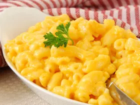 large bowl of mac & cheese in white bowl