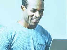 man looking at computer screen