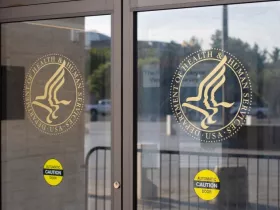 Washington, DC, USA - June 24, 2022: The symbol of the U.S. Department of Health and Human Services is seen at the entrance to its headquarters in the Hubert H. Humphrey Building in Washington, DC. 