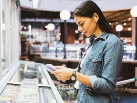 woman reading a package label