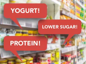 grocery store shelves with red speech bubbles reading "yogurt, lower sugar"protein, lower 