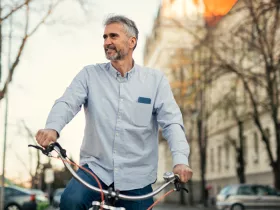 man on a bike riding through a city