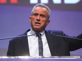 Robert F Kennedy Jr. yelling into a microphone