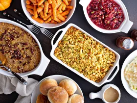 Variety of dishes at a Thanksgiving meal table