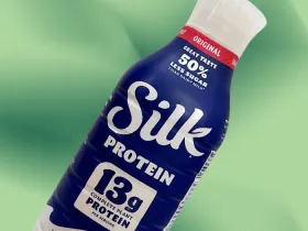 Silk protein milk on green background