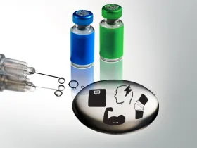 syringe with puddle of clear liquid and 2 vials