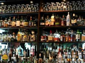 Bar shelf with a variety of liquor