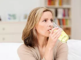 woman drinking beverage