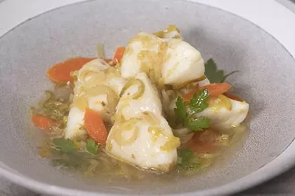 white fish poached with leeks, carrots, and celery