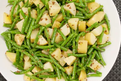 a plate of green bean potato salad
