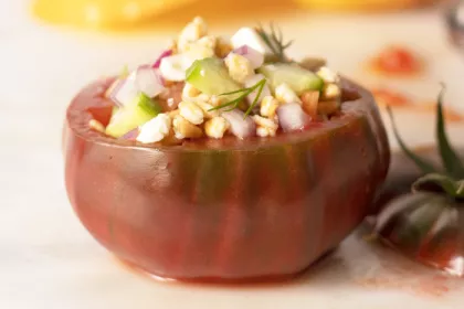 a greek farro stuffed tomato