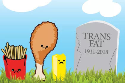 cartoon of french fries, fried chicken, and margarine next to gravestone that reads "trans fat 1911-2018."