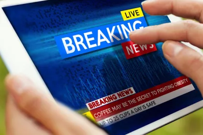 tablet with "breaking news" on it
