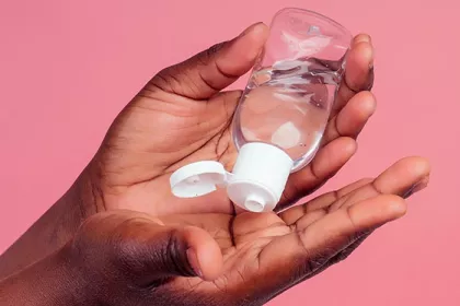 hands applying sanitizer
