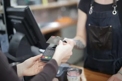 Worker holding credit card
