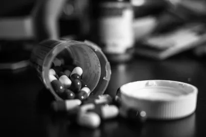 A bottle of pills spilled towards camera