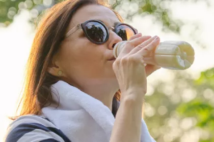 Woman drinking fermented beverage