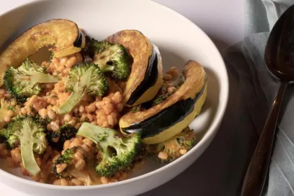 grains, broccoli, and other vegetables in white bowl