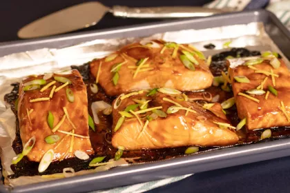 4 salmon filets with glaze drizzled over 