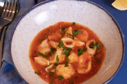 white bowl with seafood stew