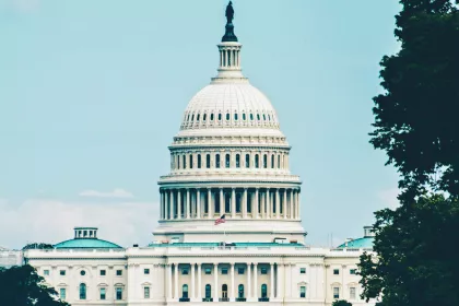 U.S. Capitol Building with a hazy blue sky in the background