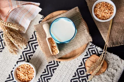 grains and bowl of milk laid on burlap