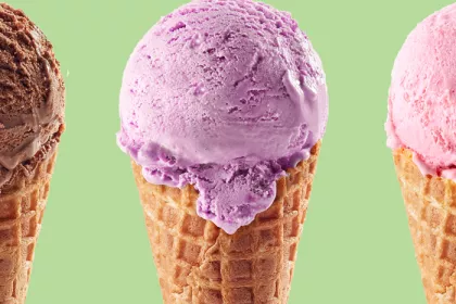 3 ice cream cones with one chocolate scoop, one purple scoop, one pink scoop on a green background.