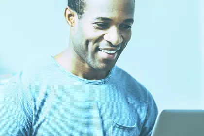 man looking at computer screen