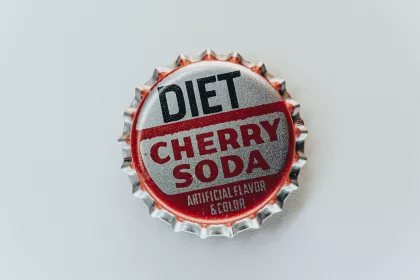 Bottle cap that say "Diet Cherry Soda - Artificial Flavor & Color"