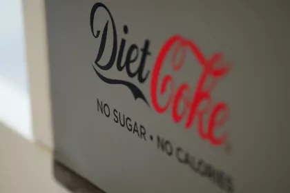 A sign that reads "Diet Coke: no sugar - no calories"