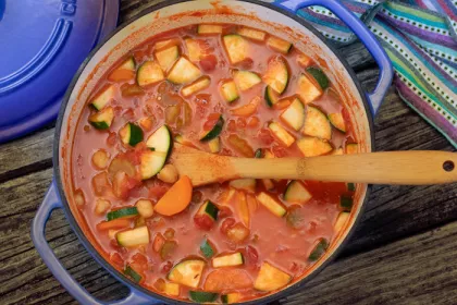 over head shot of large pot filled with minsestrone stew