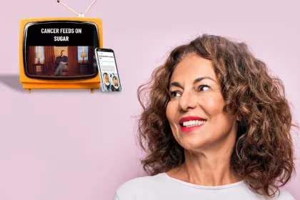 pink background with woman looking towards a tv and phone with diet ads on them