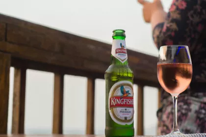 A bottle of beer and a glass of rosé