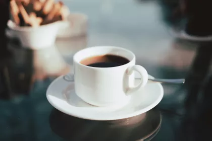 A cup of black coffee.