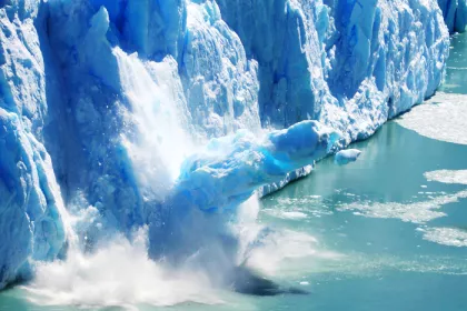 a glacier melting into a lake