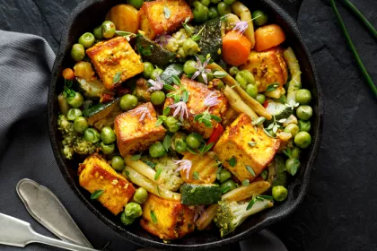 skillet filled with vegetables and tofu