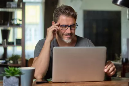 man looking at a computer screen